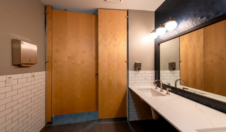 Bathroom stall photo emphasizing dimensions