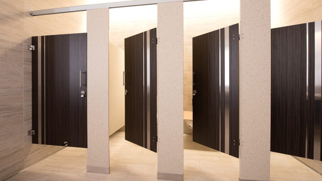 Toilet partition slab doors with inlays.