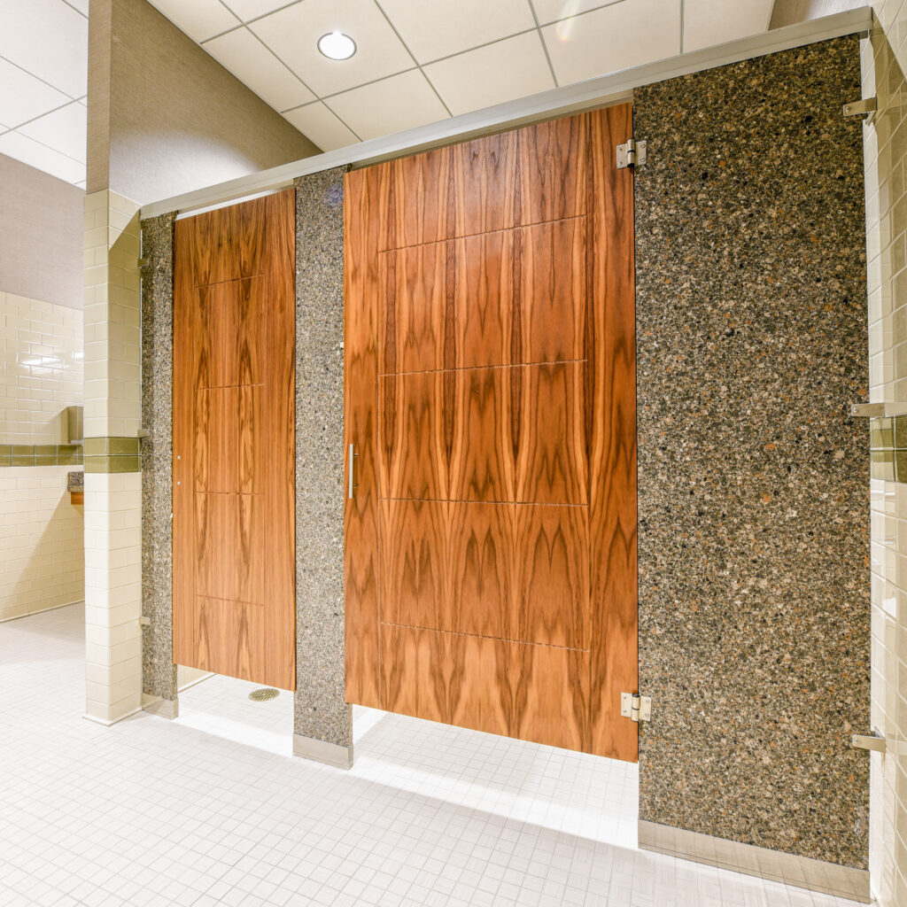 Toilet partition slab doors with organic materials