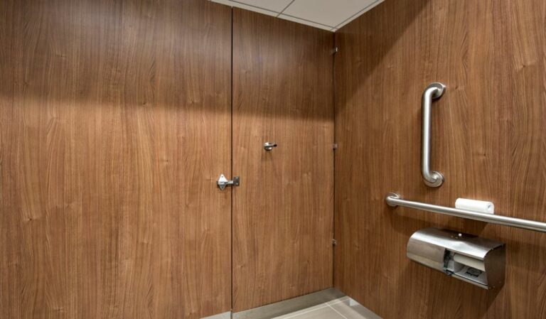 Toilet partition showing ADA elements such as grab bars.