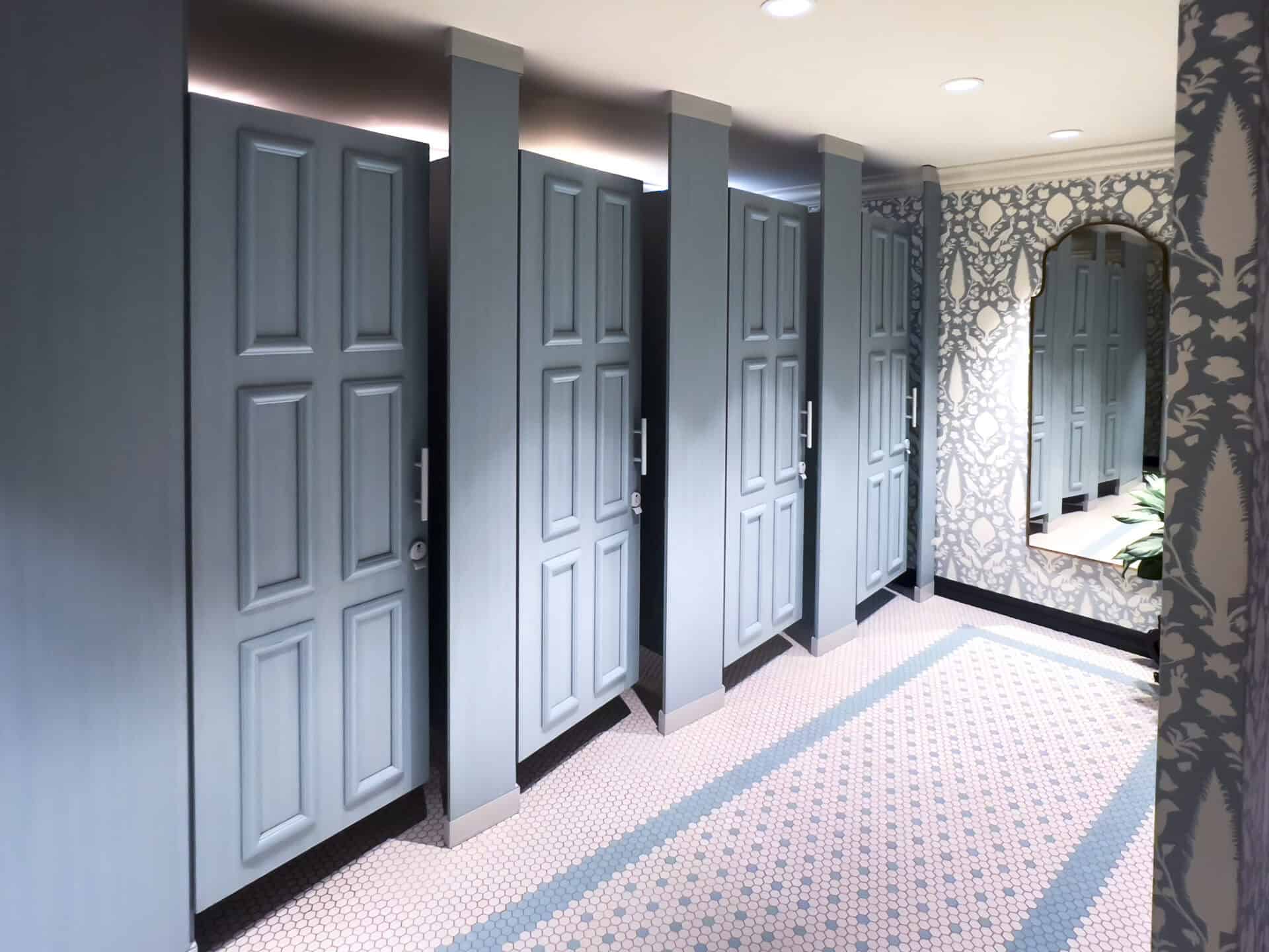 Floor To Ceiling toilet partitions in plastic laminate for a hospitality application.