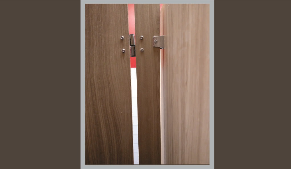Toilet partition with wall gap.